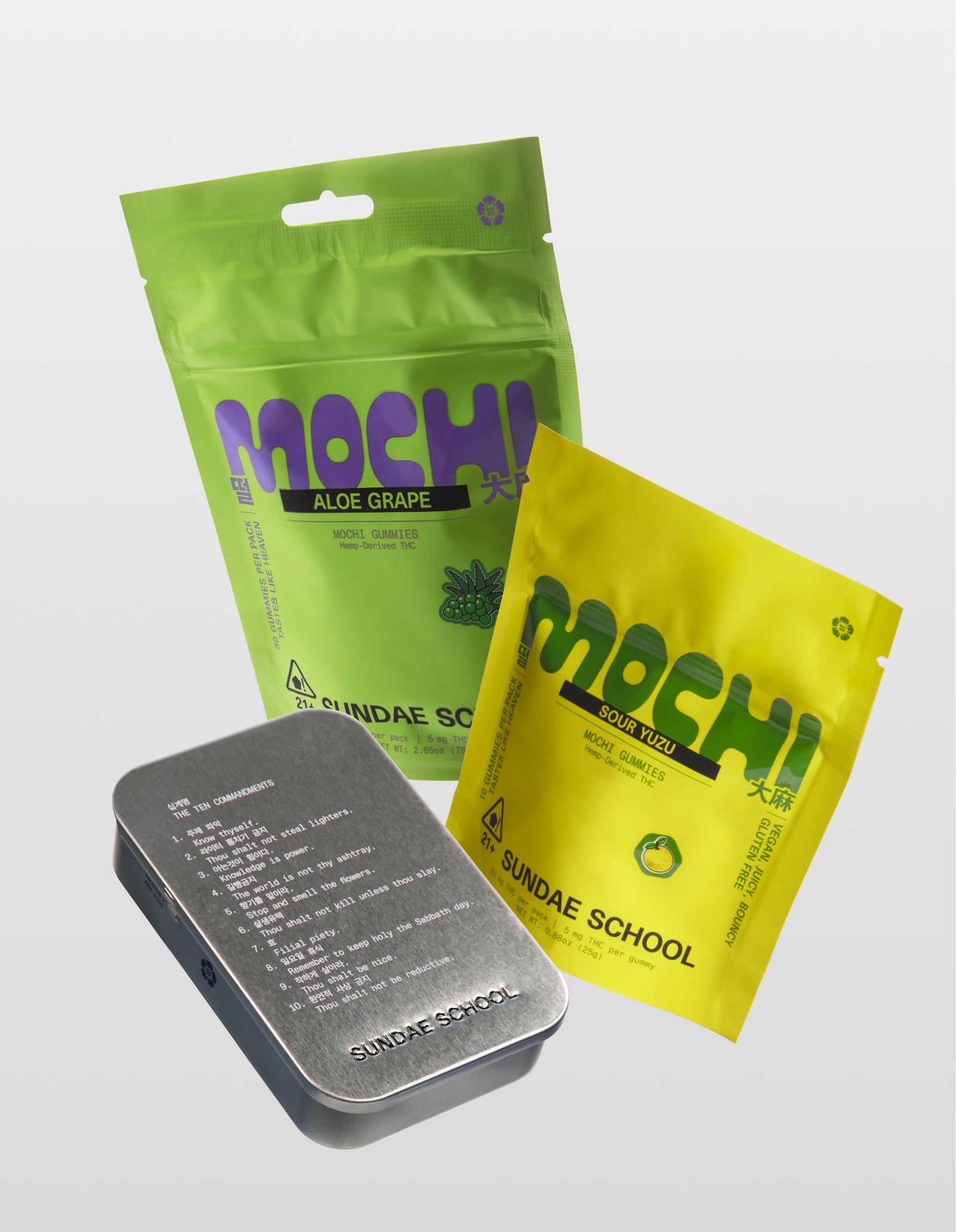 Sundae School mochi gummies CA Sober product bundle featuring Aloe Grape 30-Pack, Sour Yuzu 10-pack, and silver metal tin container on white background