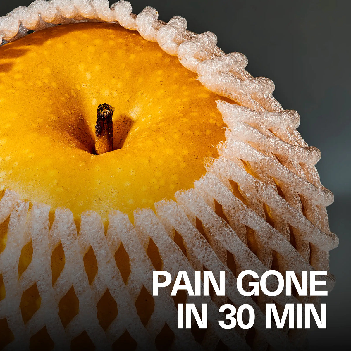 Lifestyle shot of whole golden pear fruit, with the headline 'Pain Gone in 30 Min'