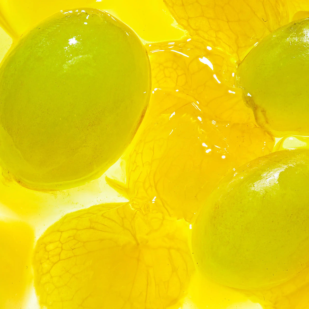 Macro lifestyle shot of peeled green grapes