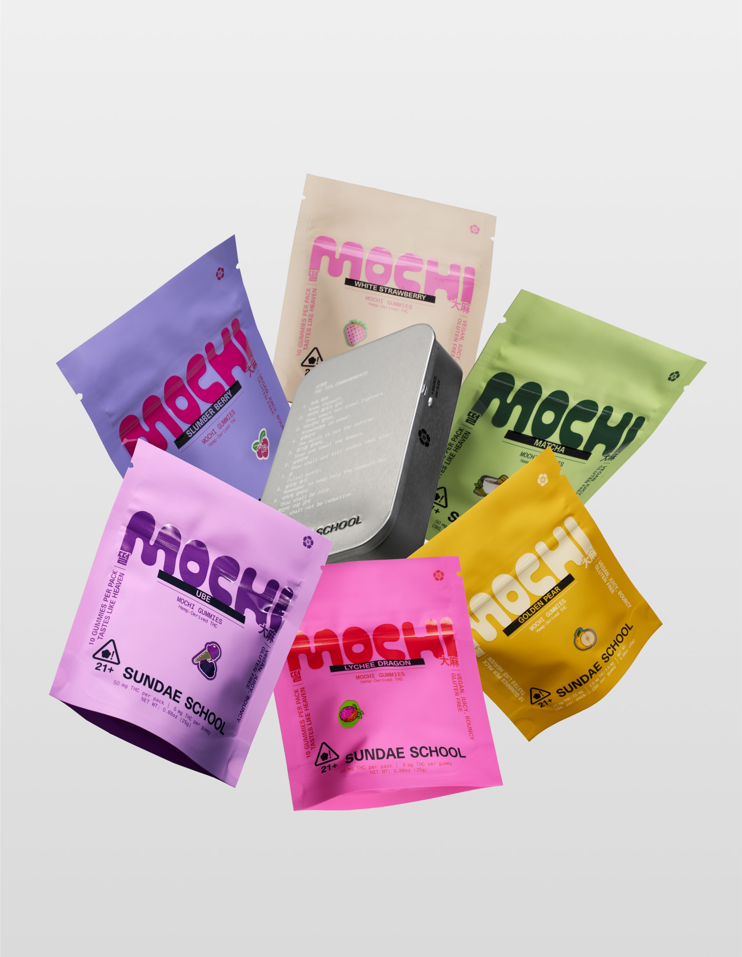Sundae School mochi gummies Hibernation Pack product bundle featuring 5mg Lychee Dragon 10-pack, 5mg Golden Pear 10-pack, 5mg Matcha 10-pack, 5mg white Strawberry 10-pack, 3mg Slumber Berry 10-pack, 5mg Ube 10-pack, and a silver tin on white background