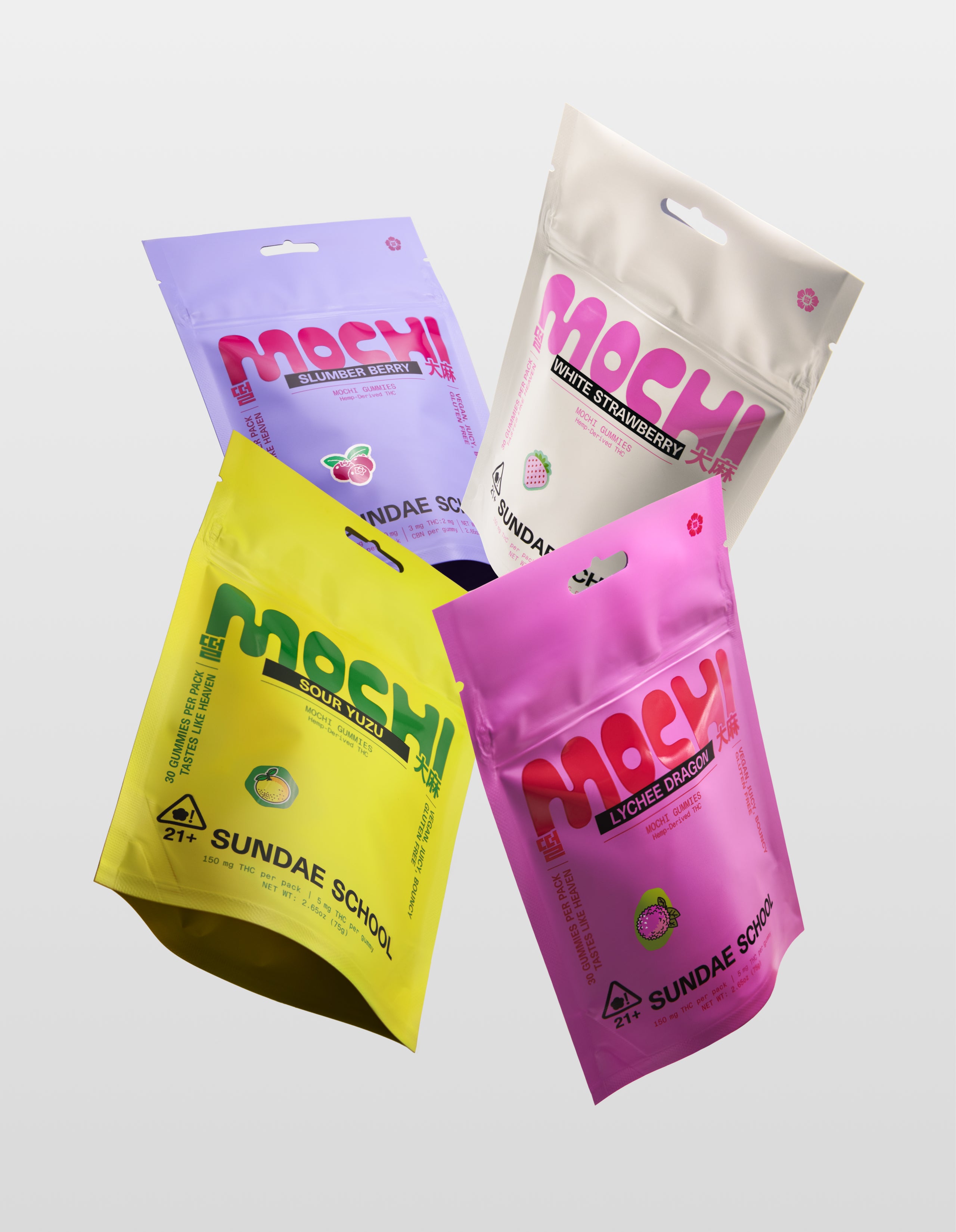 Four colorful packages of 'Mochi Gummy Mylars' in Sour Yuzu, Slumberberry, White Strawberry and Lychee Dragon flavors from 'Sundae School' on a light gray background