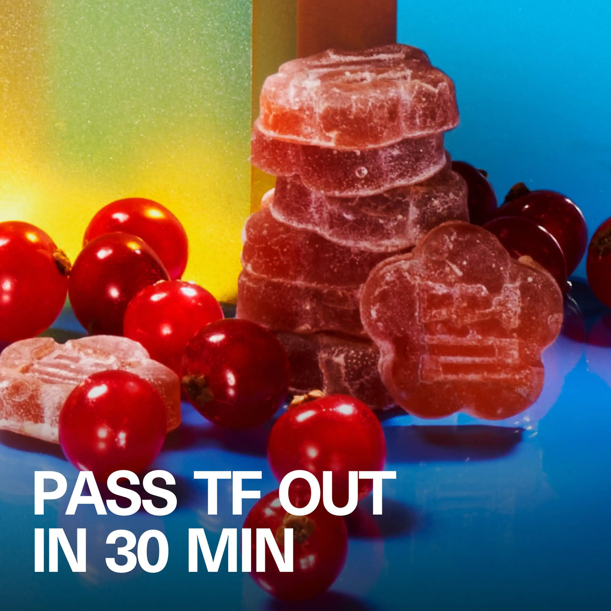 Macro lifestyle shot of a flower-shaped Sundae School Mochi Slumber Berry gummy with red berries and the headline 'Pass TF Out in 30 Min'