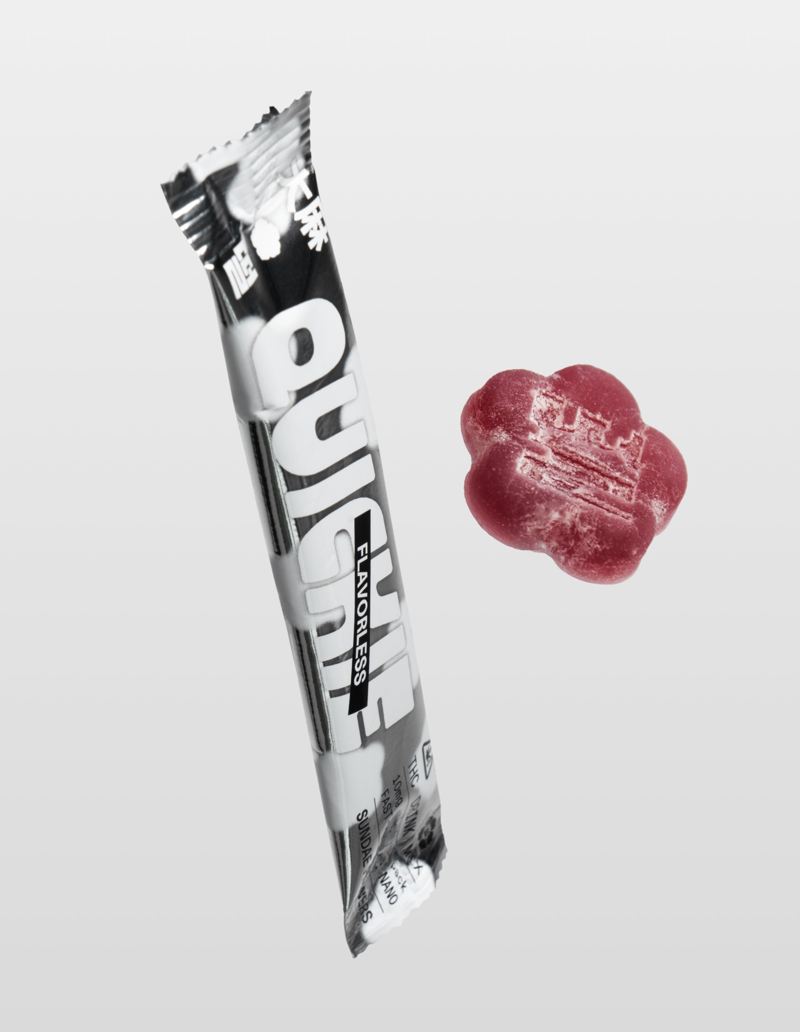 One Sundae School Flavorless Quickie stick placed next to a slumber berry mochi on a white background.