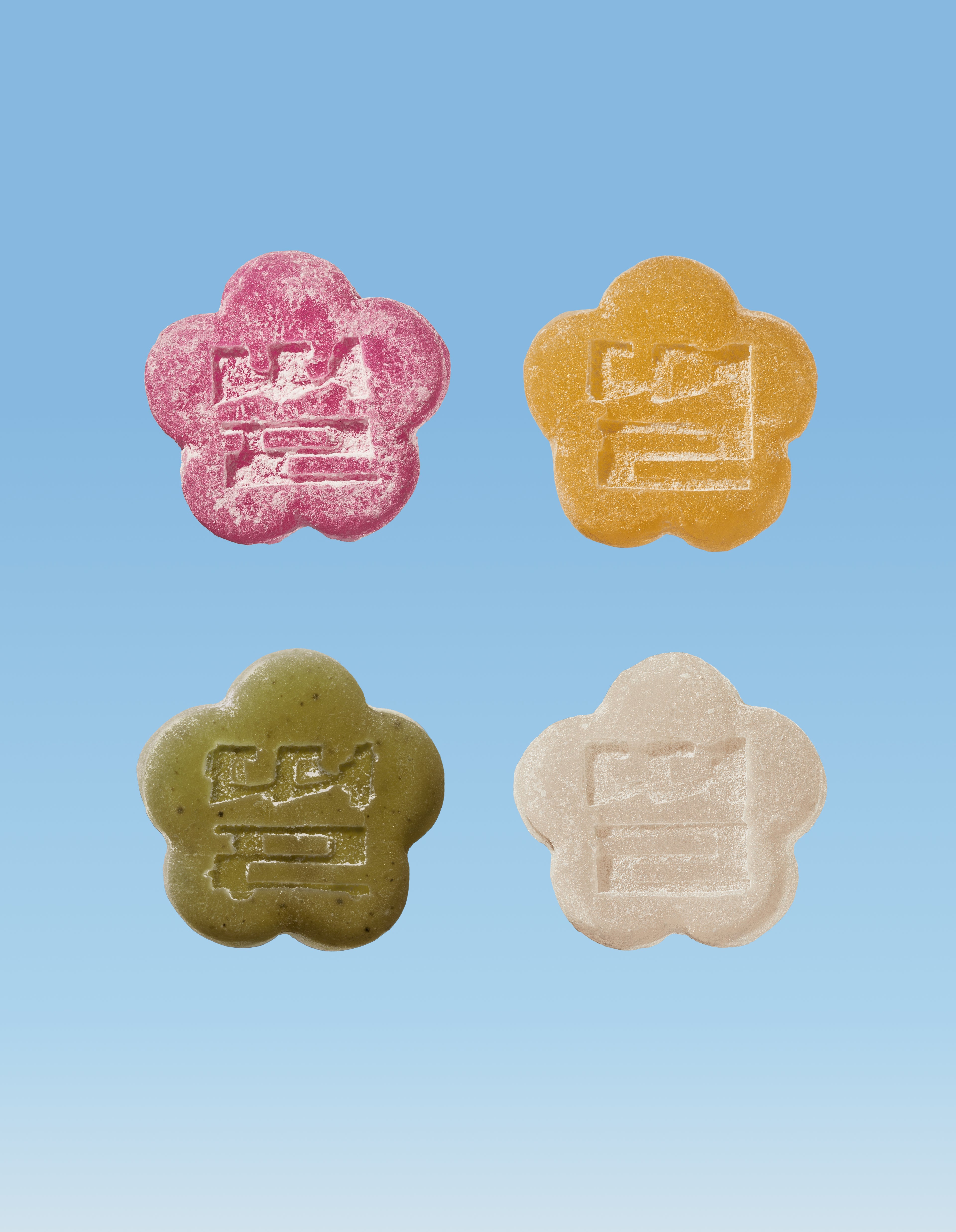 Sundae School LYCHEE DRAGON, GOLDEN PEAR, MATCHA, WHITE STRAWBERRY mochi gummies against a blue gradient background.