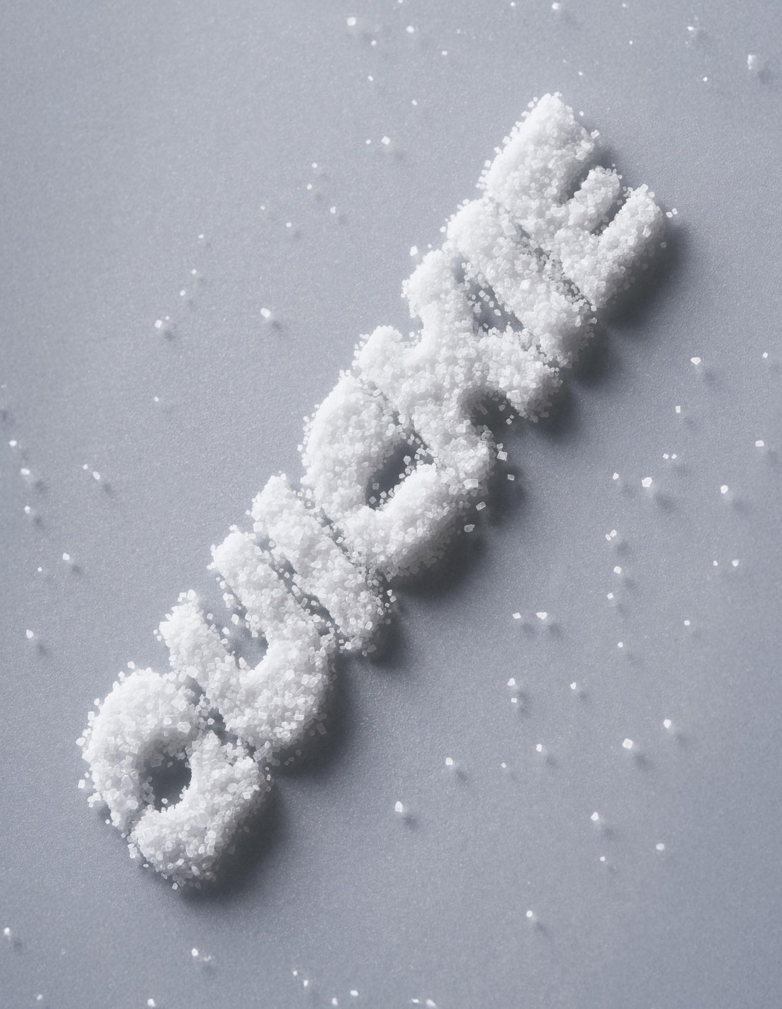 Salt-like crystals arranged to spell "Quickie"